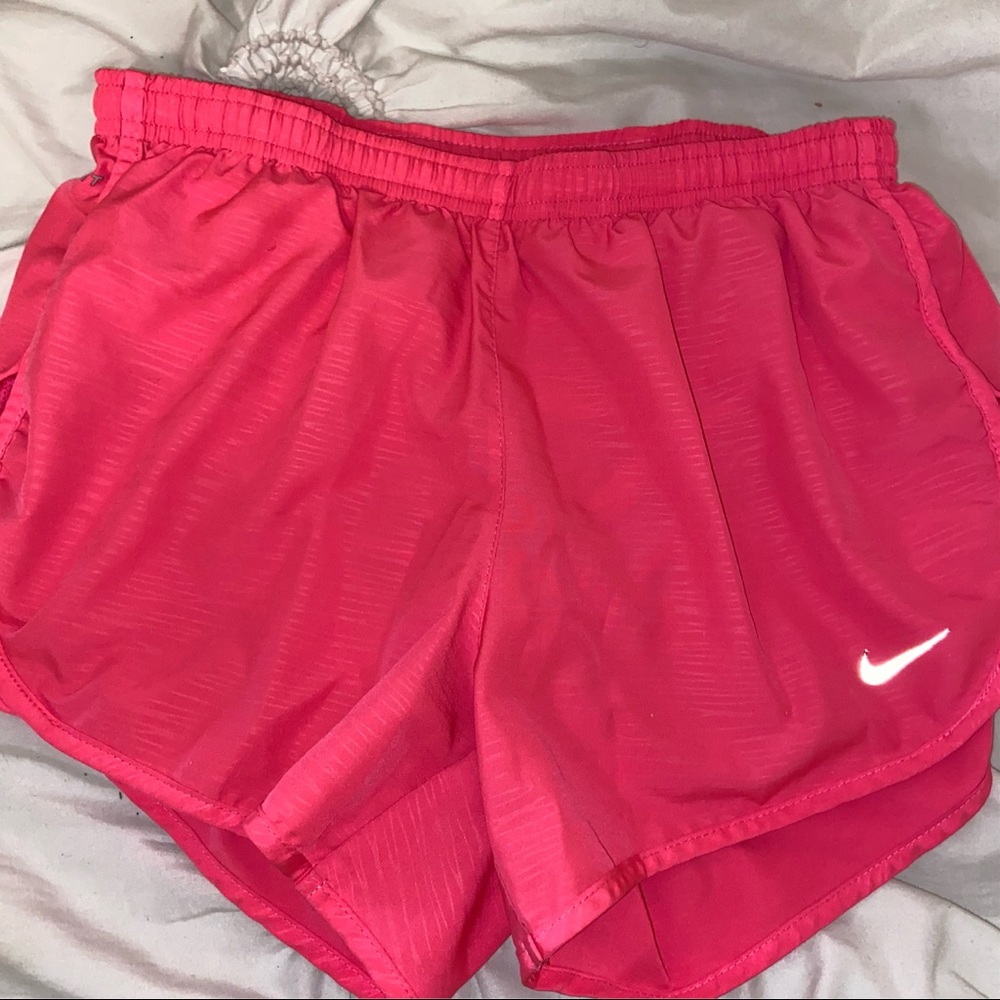 Pink Nike running shorts